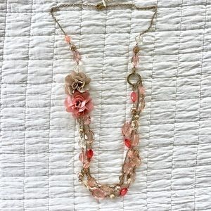 New York and Company long beaded necklace with flowers on silver chain.